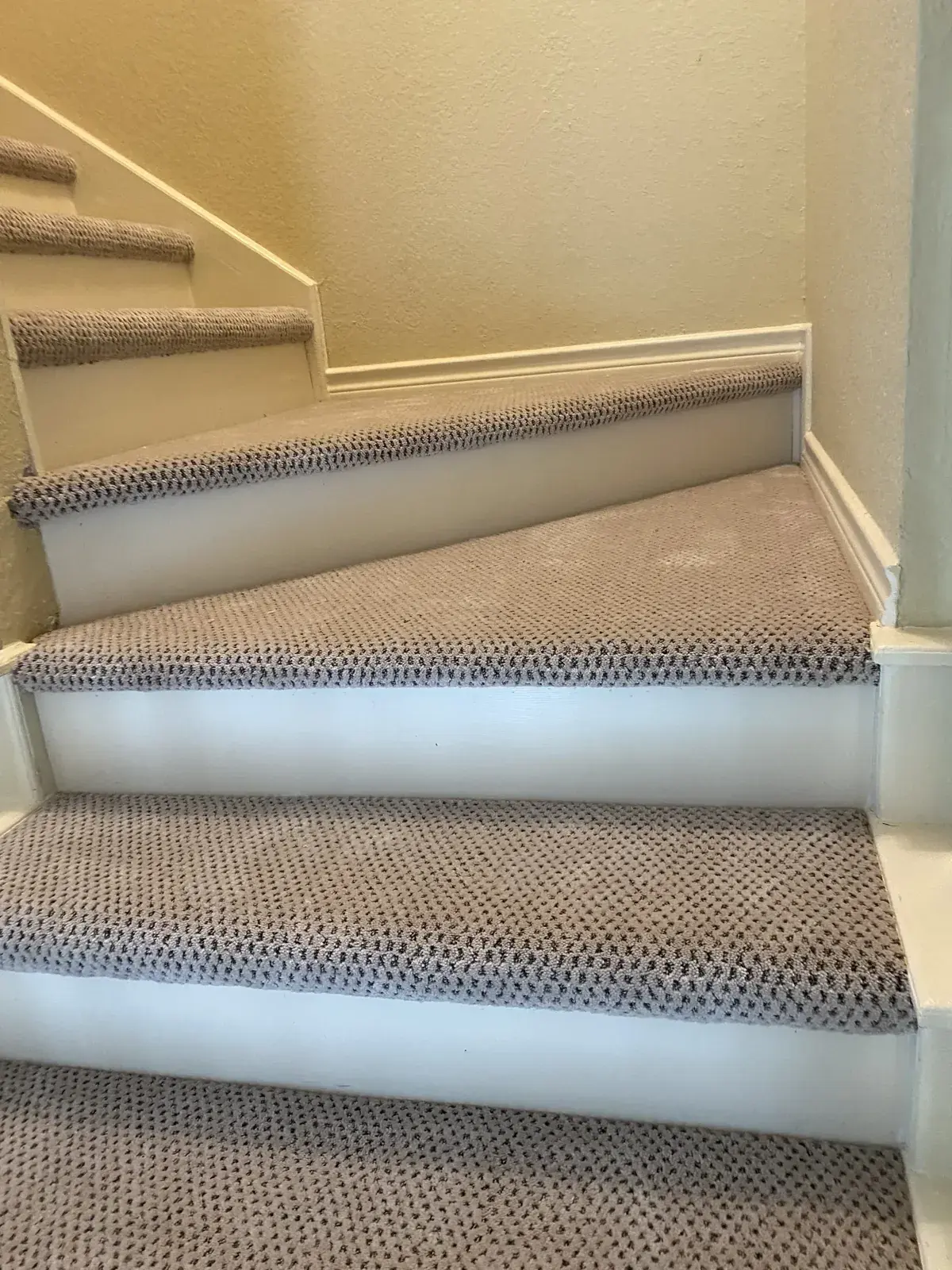 Patterned berber carpet on stair treads in Champions, Houston