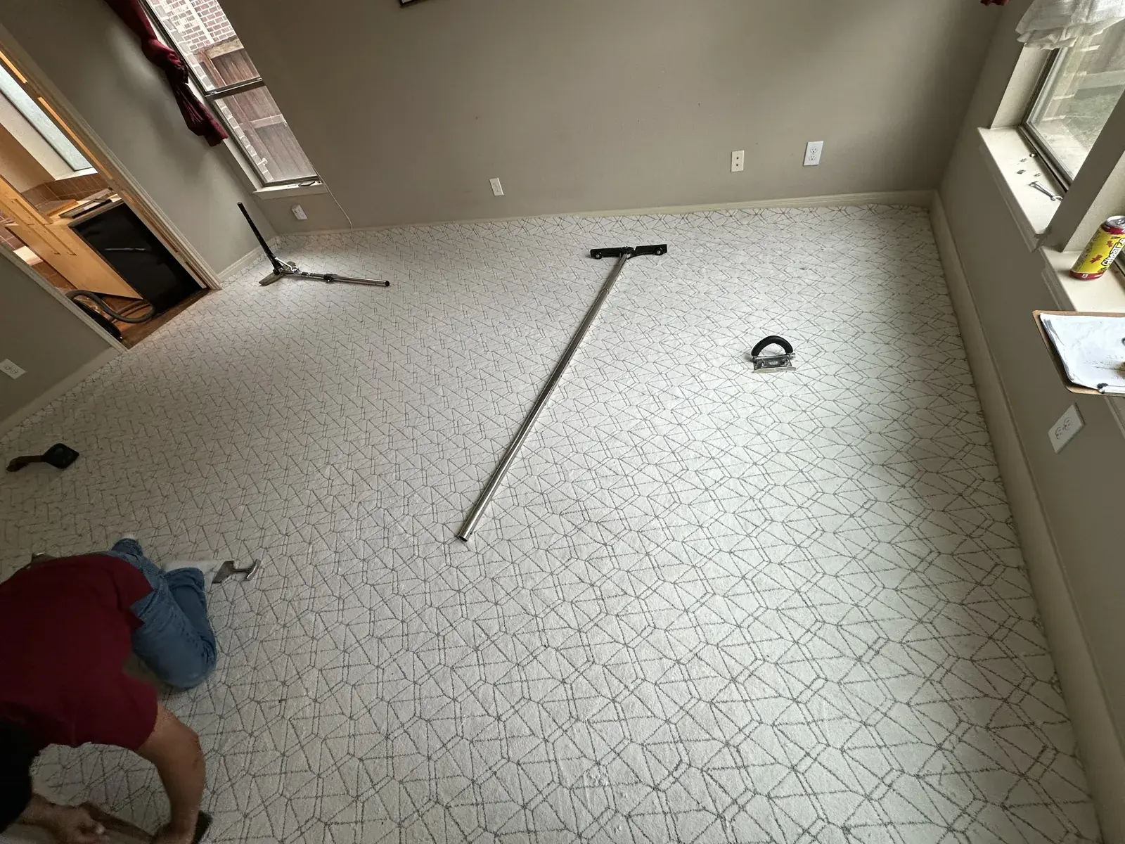 Geometric-pattern carpet being installed in The Woodlands, TX
