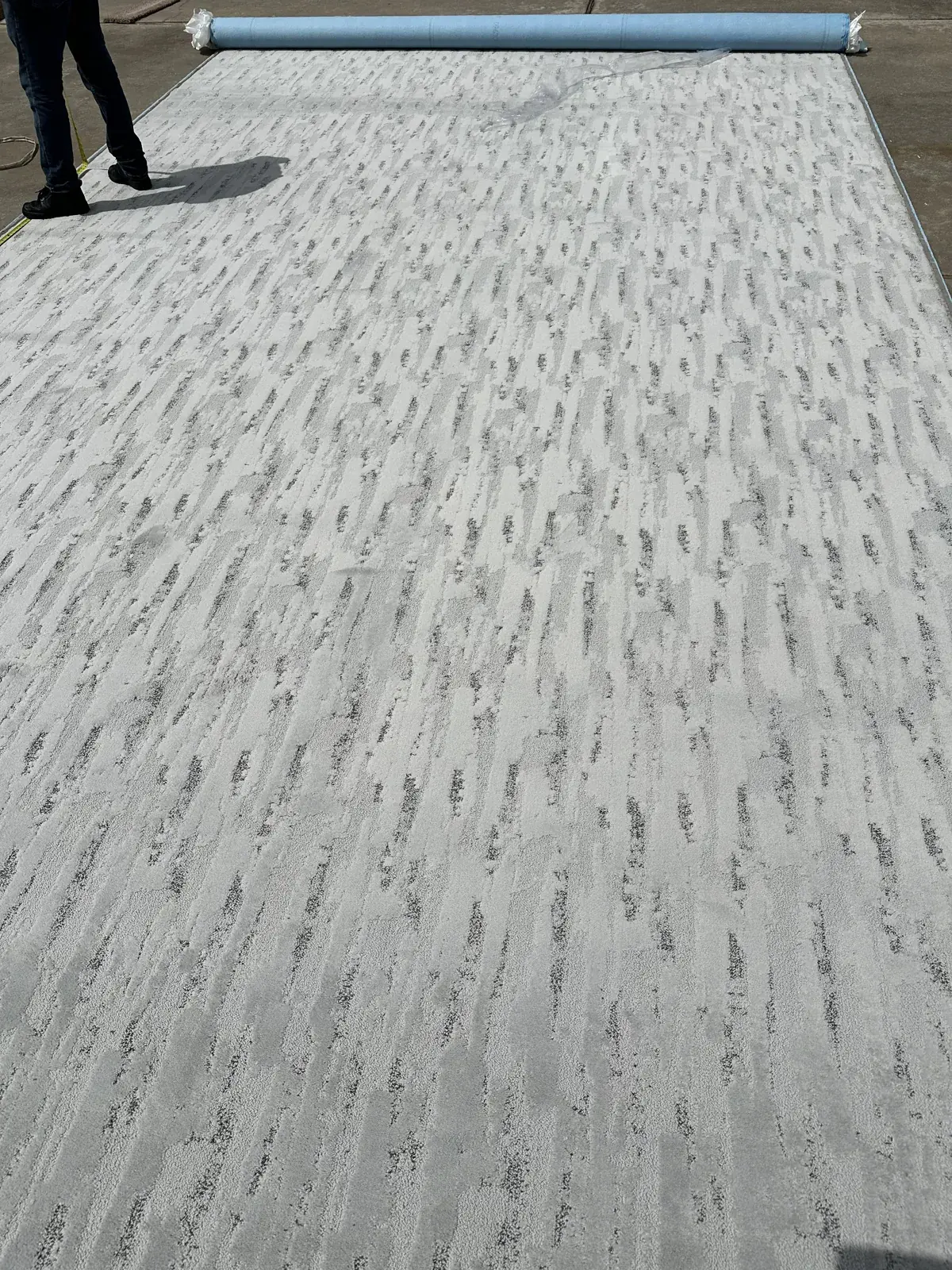 New patterned carpet rolled out and ready to cut, Houston