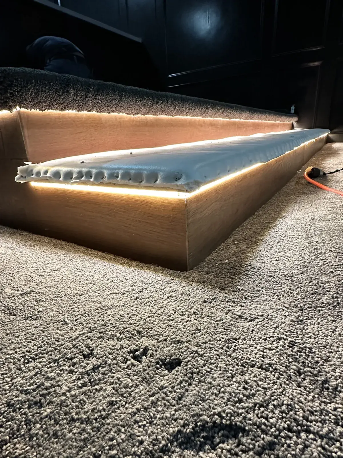 Carpet wrapped on a lighted home theater riser in Conroe, TX