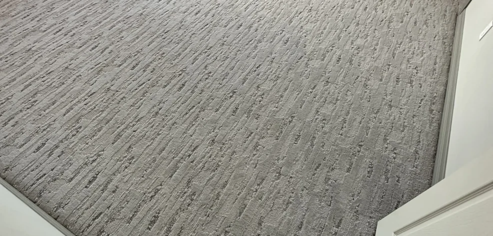 Patterned carpet installation in a Tomball bedroom